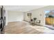 Bright sunroom with hardwood floors and sliding glass doors to a fenced-in backyard at 5527 Vin Rose Ln, Lawrence, IN 46226