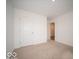 Bright, carpeted bedroom featuring white walls and ample space at 6623 Sulgrove Pl, Indianapolis, IN 46221