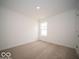Bright bedroom with neutral carpet and ample natural light at 6623 Sulgrove Pl, Indianapolis, IN 46221