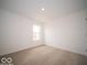 Carpeted bedroom bathed in natural light with a large window at 6623 Sulgrove Pl, Indianapolis, IN 46221