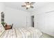 Charming bedroom with twin bed, built-in desk, and double doors at 12535 Tidecrest Dr, Fishers, IN 46037