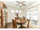 Cozy breakfast nook with round wood table and chairs, and sliding door access to patio at 12535 Tidecrest Dr, Fishers, IN 46037