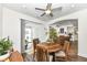 Charming breakfast nook has a round wood table and chairs near sliding doors to backyard at 12535 Tidecrest Dr, Fishers, IN 46037