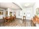 Bright dining room with hardwood floors and a wood table set at 12535 Tidecrest Dr, Fishers, IN 46037