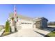 Two-car garage with brick and stone exterior at 12535 Tidecrest Dr, Fishers, IN 46037