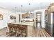 Gourmet kitchen boasts granite island, stainless steel appliances, and ample cabinet space at 12535 Tidecrest Dr, Fishers, IN 46037
