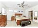 Main bedroom with king bed, ensuite bathroom access, and walk-in closet at 12535 Tidecrest Dr, Fishers, IN 46037