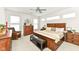 Spacious main bedroom with large bed, dresser, and seating area at 12535 Tidecrest Dr, Fishers, IN 46037