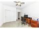 Bright home office featuring a large desk and double door closet at 12535 Tidecrest Dr, Fishers, IN 46037