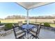 Covered patio with seating area and a view of open fields at 12535 Tidecrest Dr, Fishers, IN 46037
