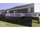 Backyard and wood deck with white railings, perfect for entertaining at 4326 Switchgrass Way, Indianapolis, IN 46237