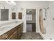 Double vanity bathroom with shower and view of bedroom at 4326 Switchgrass Way, Indianapolis, IN 46237
