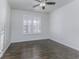Bright bedroom with wood floors and plantation shutters at 4326 Switchgrass Way, Indianapolis, IN 46237