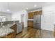 Spacious kitchen with granite countertops, stainless steel appliances, and hardwood floors at 4326 Switchgrass Way, Indianapolis, IN 46237