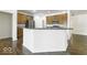 Kitchen island with granite countertop and stainless steel dishwasher at 4326 Switchgrass Way, Indianapolis, IN 46237