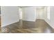 Open living area with hardwood floors and neutral walls at 4326 Switchgrass Way, Indianapolis, IN 46237