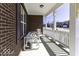Inviting covered porch with white railings, offering a relaxing space for outdoor seating at 4326 Switchgrass Way, Indianapolis, IN 46237
