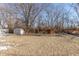 Large backyard with shed, playset, and mature trees at 3359 Laurel St, Indianapolis, IN 46227