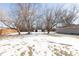 Spacious backyard with partial snow cover and two sheds at 3359 Laurel St, Indianapolis, IN 46227