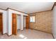 Well-lit bedroom with double closets and neutral carpeting at 3359 Laurel St, Indianapolis, IN 46227
