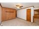 Living room with wood paneling and carpeted floors at 3359 Laurel St, Indianapolis, IN 46227