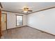 Spacious living room with carpeted floors and a ceiling fan at 3359 Laurel St, Indianapolis, IN 46227