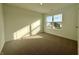 Bright bedroom with neutral carpeting and large window at 1220 Fleming Dr, Greenfield, IN 46140