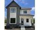 Charming two-story home featuring a modern design, sleek black windows, and stylish mixed siding at 16525 Iron Tree Ct, Westfield, IN 46074