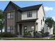 Exterior of a two-story home with gray and white siding, a covered front porch, and landscaped front yard at 16525 Iron Tree Ct, Westfield, IN 46074