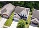 Aerial view of a two-story home with a well-manicured lawn and nearby garages at 5171 Alpine Violet Way, Indianapolis, IN 46254