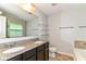 Bathroom featuring granite counters, a large mirror, shelves, and tile flooring at 5171 Alpine Violet Way, Indianapolis, IN 46254