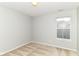 Cozy bedroom with neutral walls and carpet, and a window providing natural light at 5171 Alpine Violet Way, Indianapolis, IN 46254