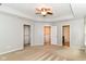 Bright bedroom featuring neutral walls, carpet, and a closet and bathroom door at 5171 Alpine Violet Way, Indianapolis, IN 46254