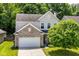 Beautiful two-story home with a brick-accented front and well-manicured lawn at 5171 Alpine Violet Way, Indianapolis, IN 46254
