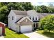 Charming two-story home with a brick-accented front and attached two car garage at 5171 Alpine Violet Way, Indianapolis, IN 46254