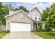 Charming two-story home with a brick facade, attached two-car garage, and well-maintained lawn at 5171 Alpine Violet Way, Indianapolis, IN 46254