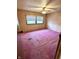 Bedroom featuring pink carpet, overhead lighting and double window at 8418 S State Road 39, Clayton, IN 46118