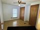 Comfortable bedroom features a ceiling fan, wood-look flooring, closet, and natural light at 8418 S State Road 39, Clayton, IN 46118