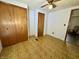 Cozy bedroom features a ceiling fan, wood-look flooring, closet and natural light at 8418 S State Road 39, Clayton, IN 46118