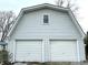 Spacious two-car garage with white siding and overhead doors, providing ample parking and storage space at 8418 S State Road 39, Clayton, IN 46118