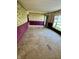 Bright and airy living room featuring carpet floors, and large windows at 8418 S State Road 39, Clayton, IN 46118