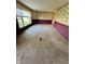 Large living room featuring carpet flooring, natural light, and ample space at 8418 S State Road 39, Clayton, IN 46118