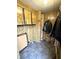 Functional mudroom with wood-paneled walls, storage cabinets, and tiled flooring, providing practical entryway at 8418 S State Road 39, Clayton, IN 46118