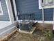 View of the home's air conditioner unit, protected by a black metal security cage on a concrete pad at 329 Lincoln St, Indianapolis, IN 46225