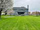 Spacious backyard featuring a covered porch and large grassy area, ideal for outdoor activities at 14914 Annabel Ct, Westfield, IN 46074