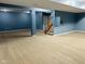 Large finished basement featuring neutral carpeting, blue walls and structural support beams at 14914 Annabel Ct, Westfield, IN 46074
