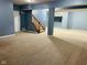 Finished basement with blue walls, and stairs leading to upper level at 14914 Annabel Ct, Westfield, IN 46074