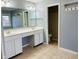 Bathroom with dual sinks, white cabinetry, and tiled floors at 14914 Annabel Ct, Westfield, IN 46074