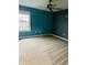 Spacious bedroom with large window, neutral carpet, and ceiling fan at 14914 Annabel Ct, Westfield, IN 46074