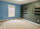 Bedroom with industrial shelves and large window for plenty of natural light at 14914 Annabel Ct, Westfield, IN 46074